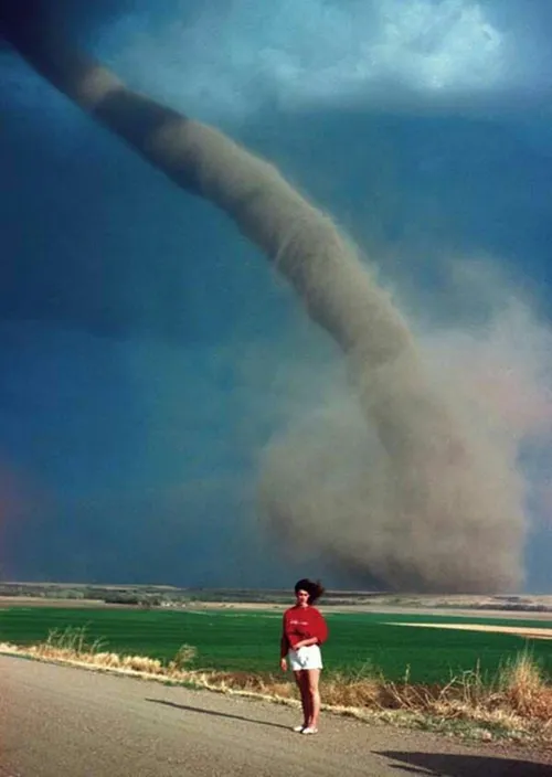 Audra Thomas posed as an F1 tornado swirls a mile away to