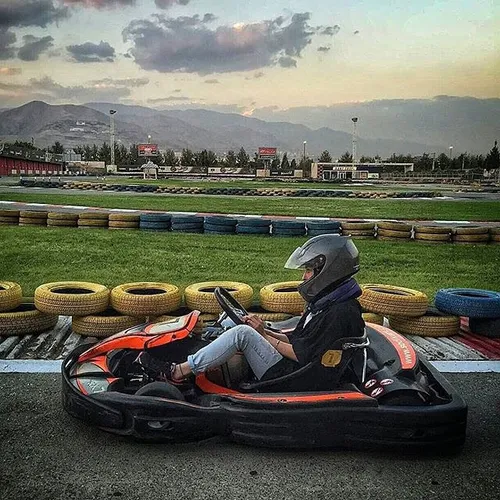 A woman's getting ready to ride in the karting court of A