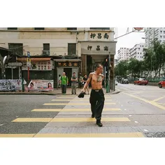 Topless man crossing the street at Yu Chau Street, Sham S