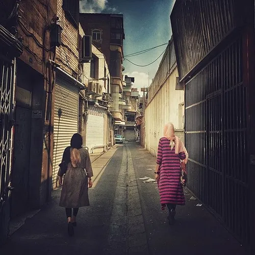 Women walking in an old neighborhood in Tehran, Iran. Pho