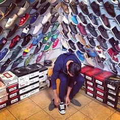 A man tries on a pair of shoes at a shoe store. #Yazd, #I