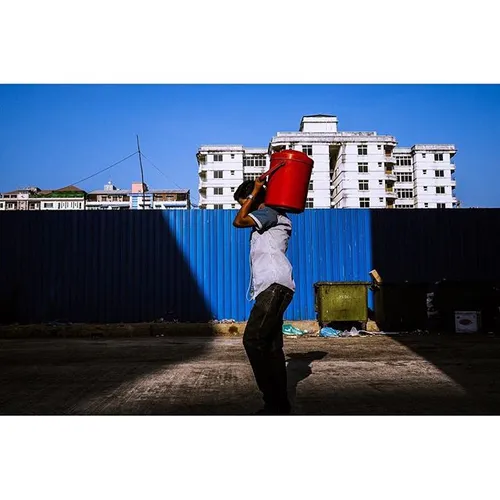 A man walks up 46th street in Yangon, Myanmar. @amcapture