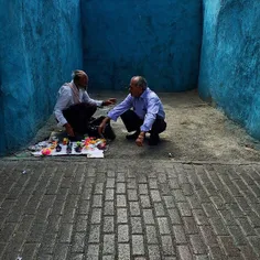 An old vendor working in the vicinity of Imam Reza’s Shri