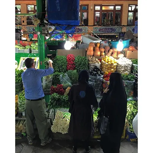 Women are buying vegetables at the old Tajrish fruit mark