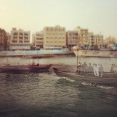Abras pass by with their passengers on Dubai Creek this a