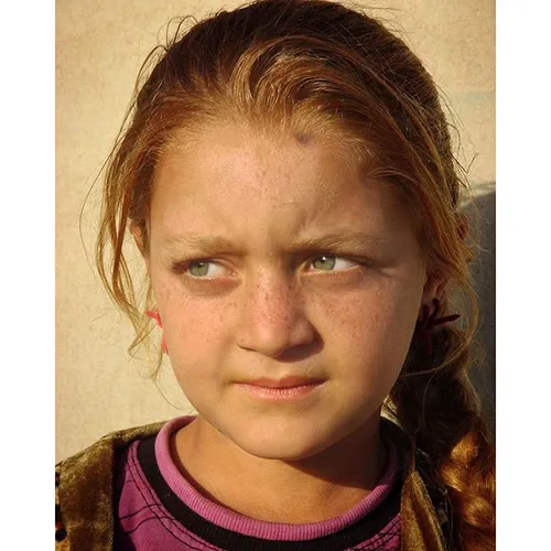 "Portrait of young girl who lives in my camp." Photo by S