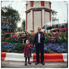 A man and his grandchild burning Espand in celebrating No