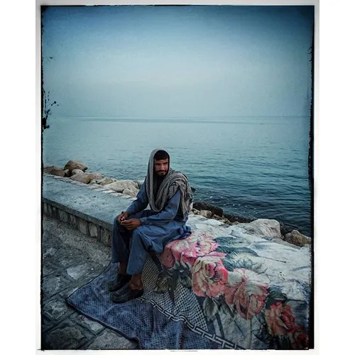 Portrait of an emigrant Afghan worker in Bandar Kangan, B