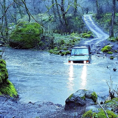 Adventurers crossing a river at a primeval forest in Asta