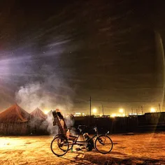 An Indian cycle rickshaw puller cooks dinner for himself 