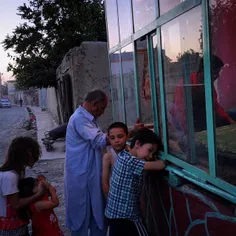 Children queue outside one of Kabul's thousands of bakeri