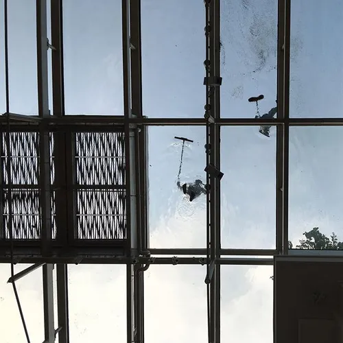 Cleaners cleaning the glass panels at the new National Ga