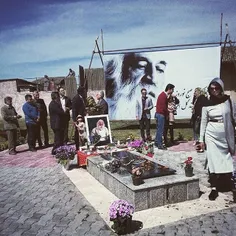 People visiting MohammadReza Lotfi's tomb, an Iranian wel