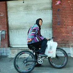 #dailytehran #Tehran #sidewalk #bicycle #woman #tehranpic