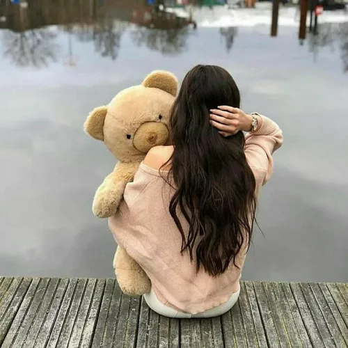 a friendly girl with a beautiful bear