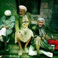 Old Yemeni men sit around inside the old city of #Sanaa, 