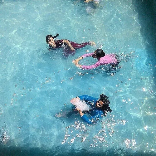 Girls swimming in a pool. Mashhad, RazaviKhorasan Iran.