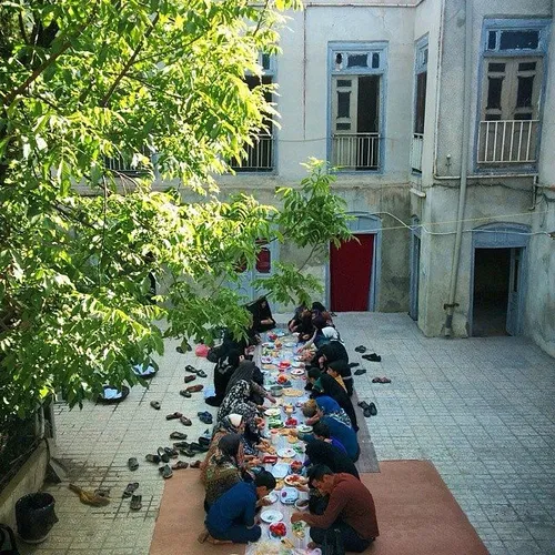 A large family having breakfast altogether at the houseya