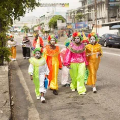 A posse of clowns roles through the streets of #PortOfSpa