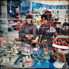 Women are busy buying the items of Haft-Seen table at a s