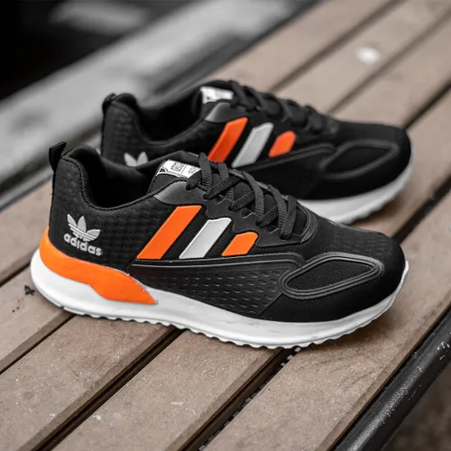 کفش ورزشی Adidas مردانه مشکی نارنجی مدل Tilda