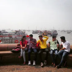 Friends hang out at the India Gate pier in #Mumbai #India