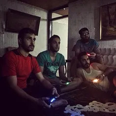 Young men playing PS4 at home. #Rasht, #Gilan, #Iran. Pho