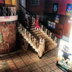 The caretaker of "Bambino Cinema" stands near it's stairw