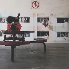 Man taking a nap at the void deck of Rochor Centre.