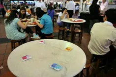 عجیب ترین شیوه رزرو کردن میز در سنگاپور 