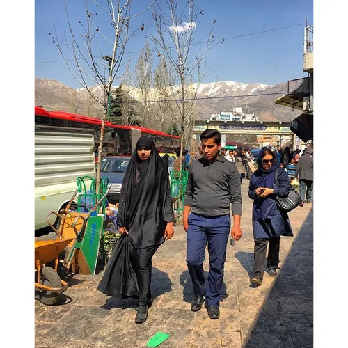 Young couple are walking around the Tajrish square, north
