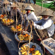 Street vendors gathers and waits to sell fruits to custom