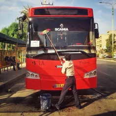 A driver cleans his bus down on street. #Ahwaz, #Khuzesta