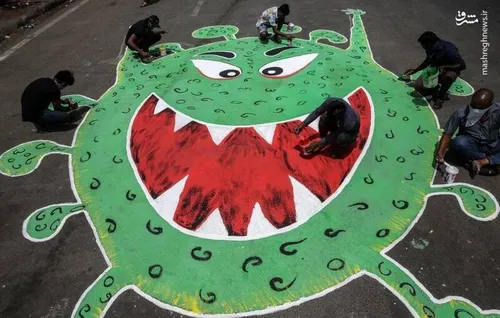 نقاشی تصویری نمادین از ویروس کرونا در خیابانی در بمبئی هن