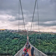 Visitors walking through the Middle East’s longest suspen