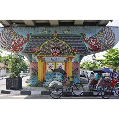 Cycle taxi drivers taking a break from the heat in Yogyak