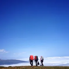 Hikers walk along a cloudy valley at Mazichal Village. In