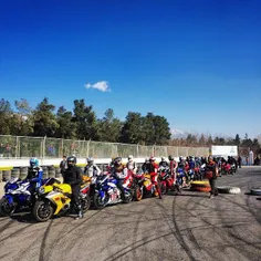 Motorcyclists get ready to compete in a race. Azadi Sport