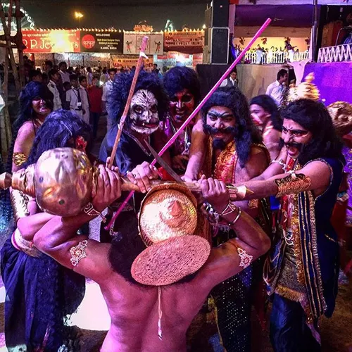 Indian artists dressed as evil tries to suppress lord Ram