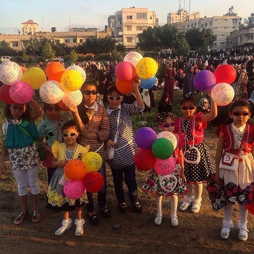 Palestinian girls attend open air Eid al-Fitr prayers to 