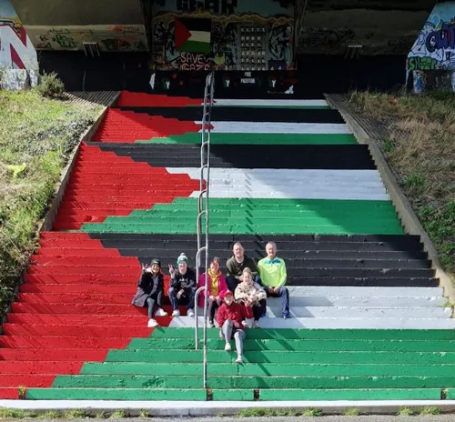 Activists paint the steps underneath Foyle Bridge in Derr