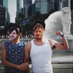 Tourists from South Korea posing in front of Merlion Park