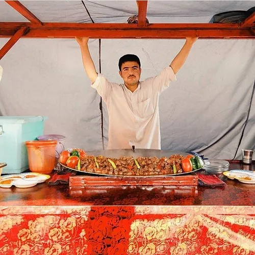 Karayi (food) maker poses for photographer. Kabul Afghani