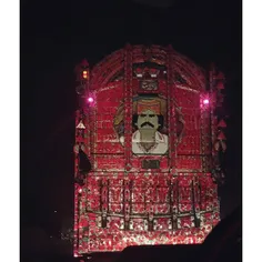 A huge intricately decorated truck donning the image of J