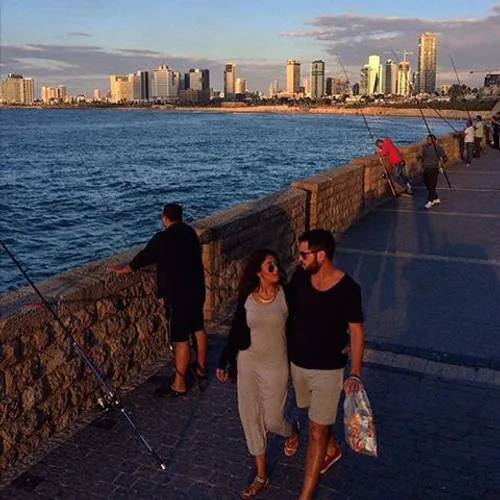 A couple enjoy the sunset at Jaffa beach. iPhone photo by