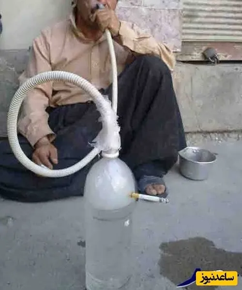 خلاقیت خنده دار یک ایرانی برای کشیدن همزمان قلیان و سیگار