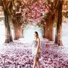 Tourist posed for photographer (unseen) as the background