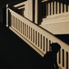 A child walking down the stairs after her ballet class at