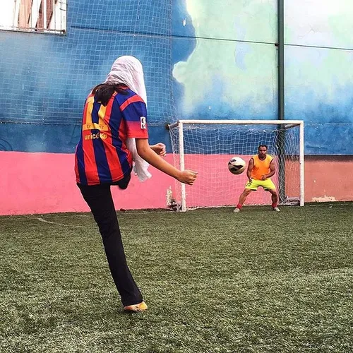 Playing football in an artificial turf. Tehran, Iran. Pho