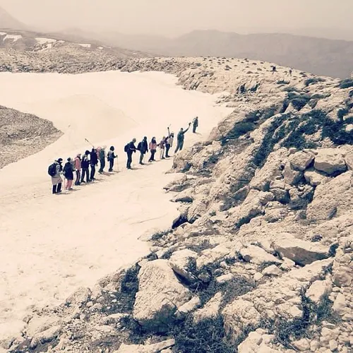 A group of mountain climbers on their way to get to the s